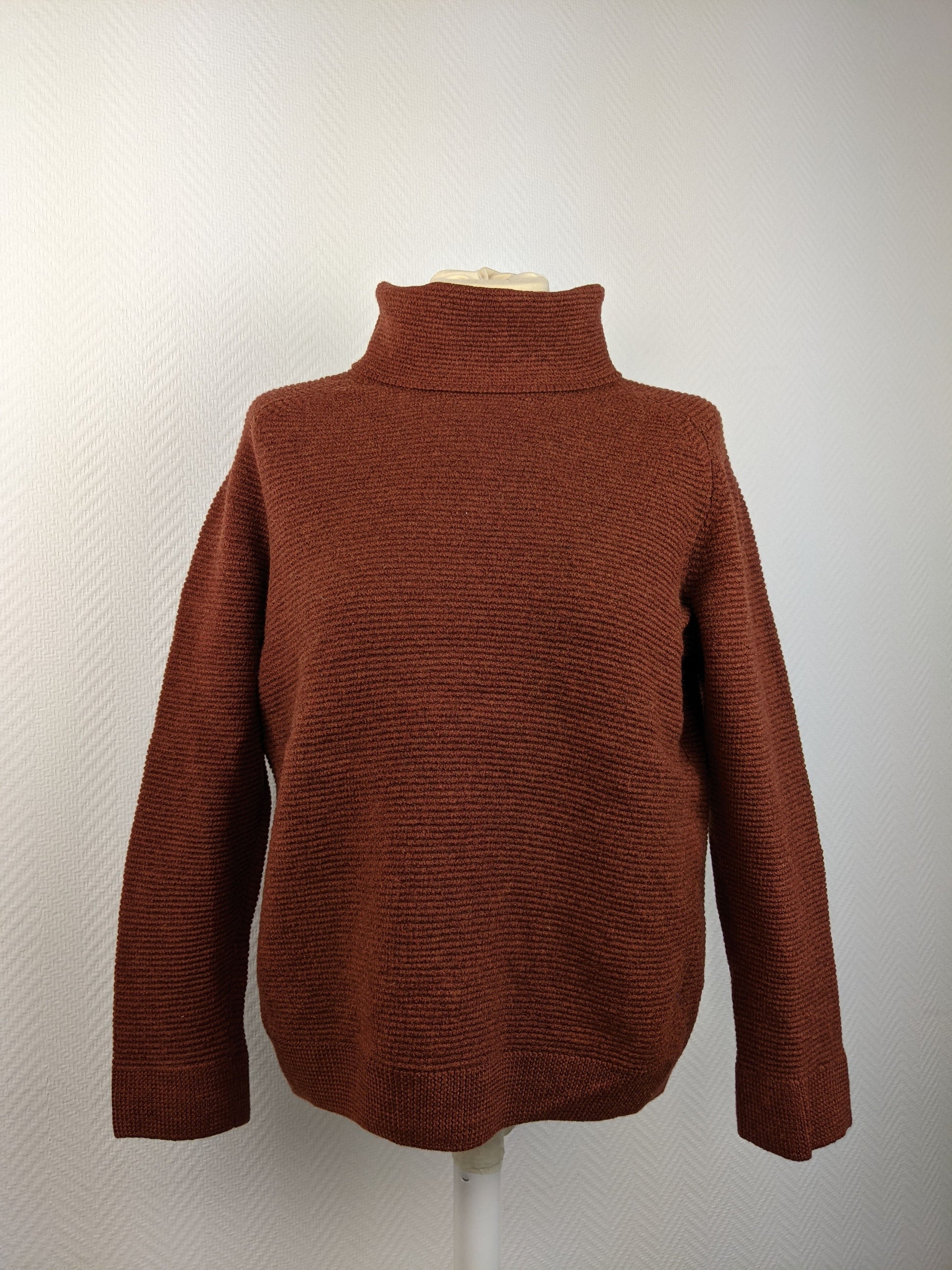Front view of brown sweater on mannequin