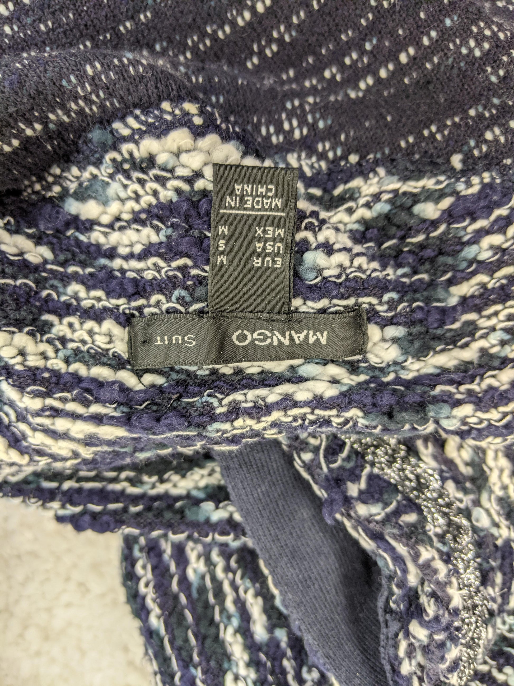 Mango textured knit coat label showing size and brand