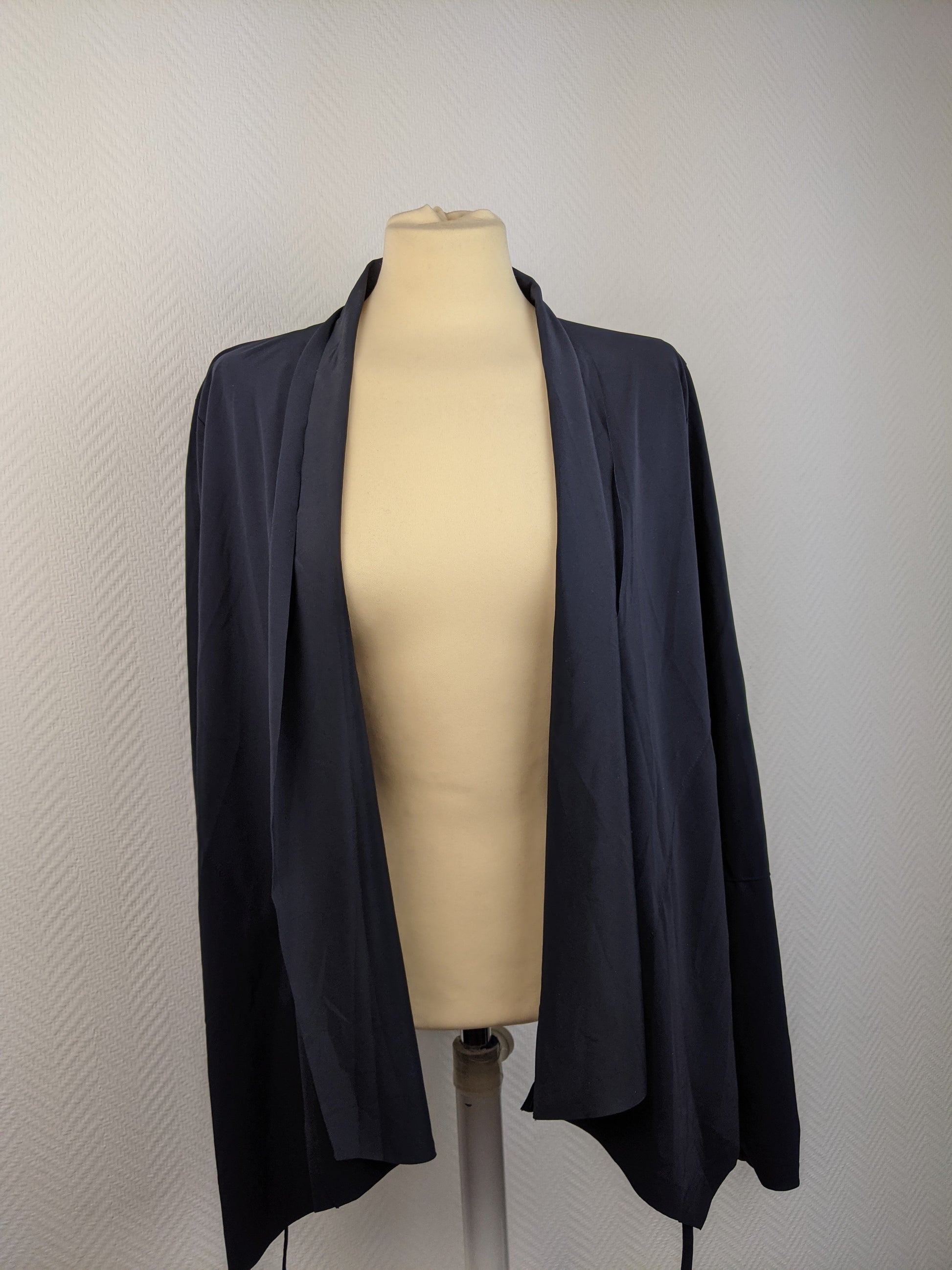 Front view of navy blue open-front cardigan on mannequin