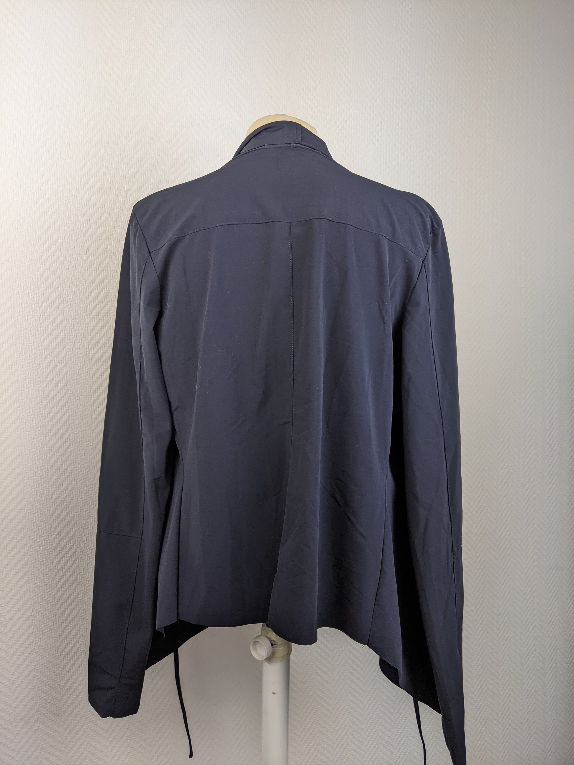 Back view of navy blue open-front cardigan on mannequin
