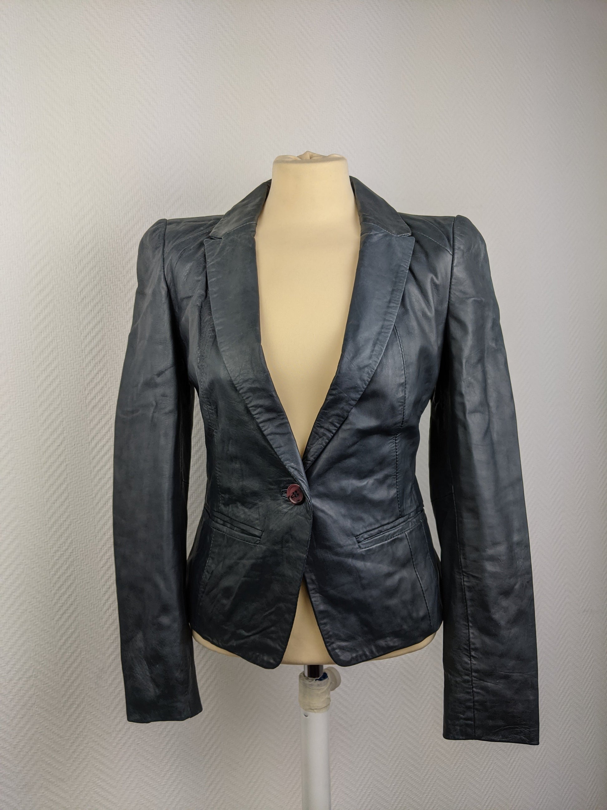 Front view of black leather blazer
