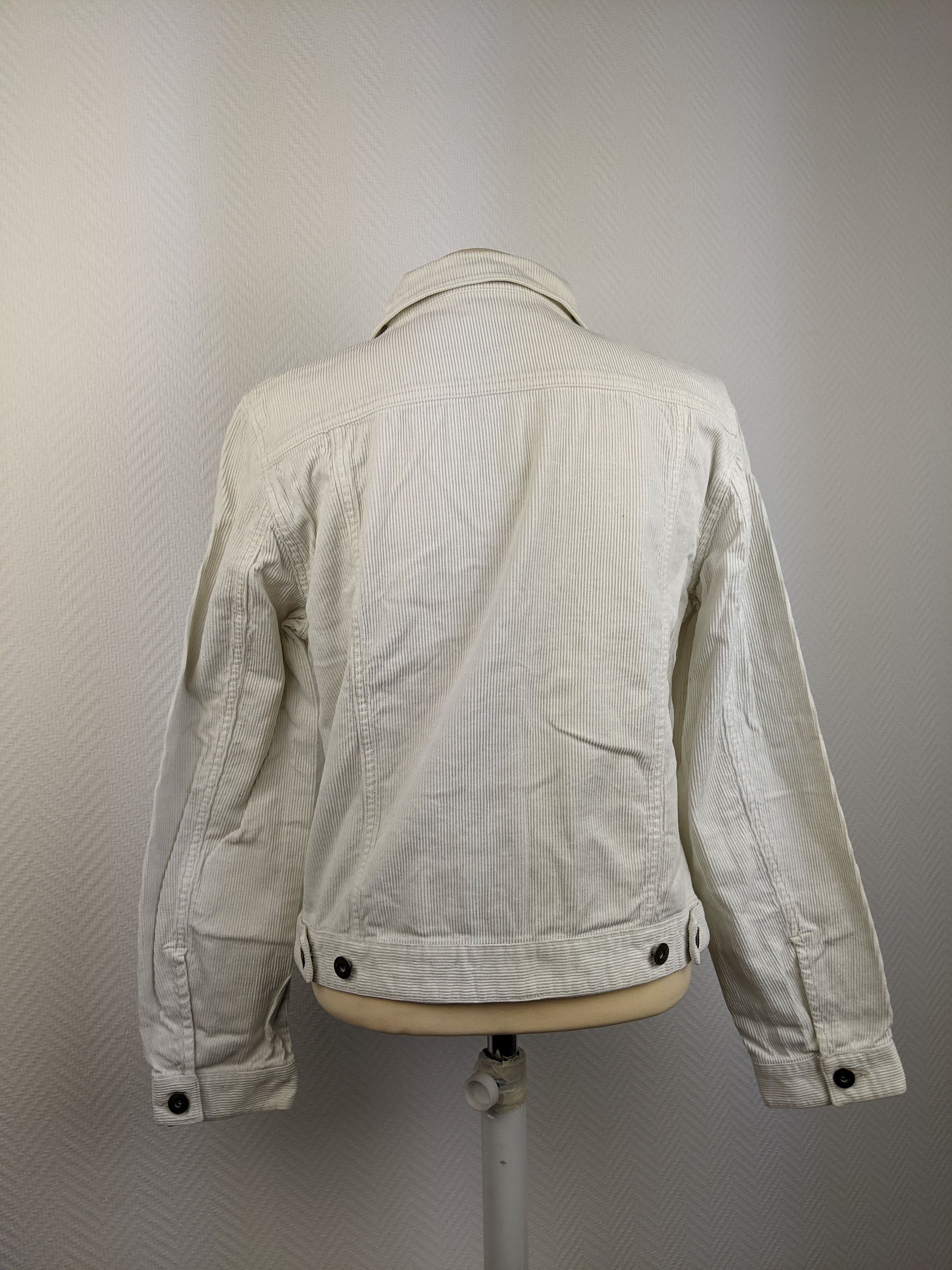 Back view of cream corduroy jacket on mannequin