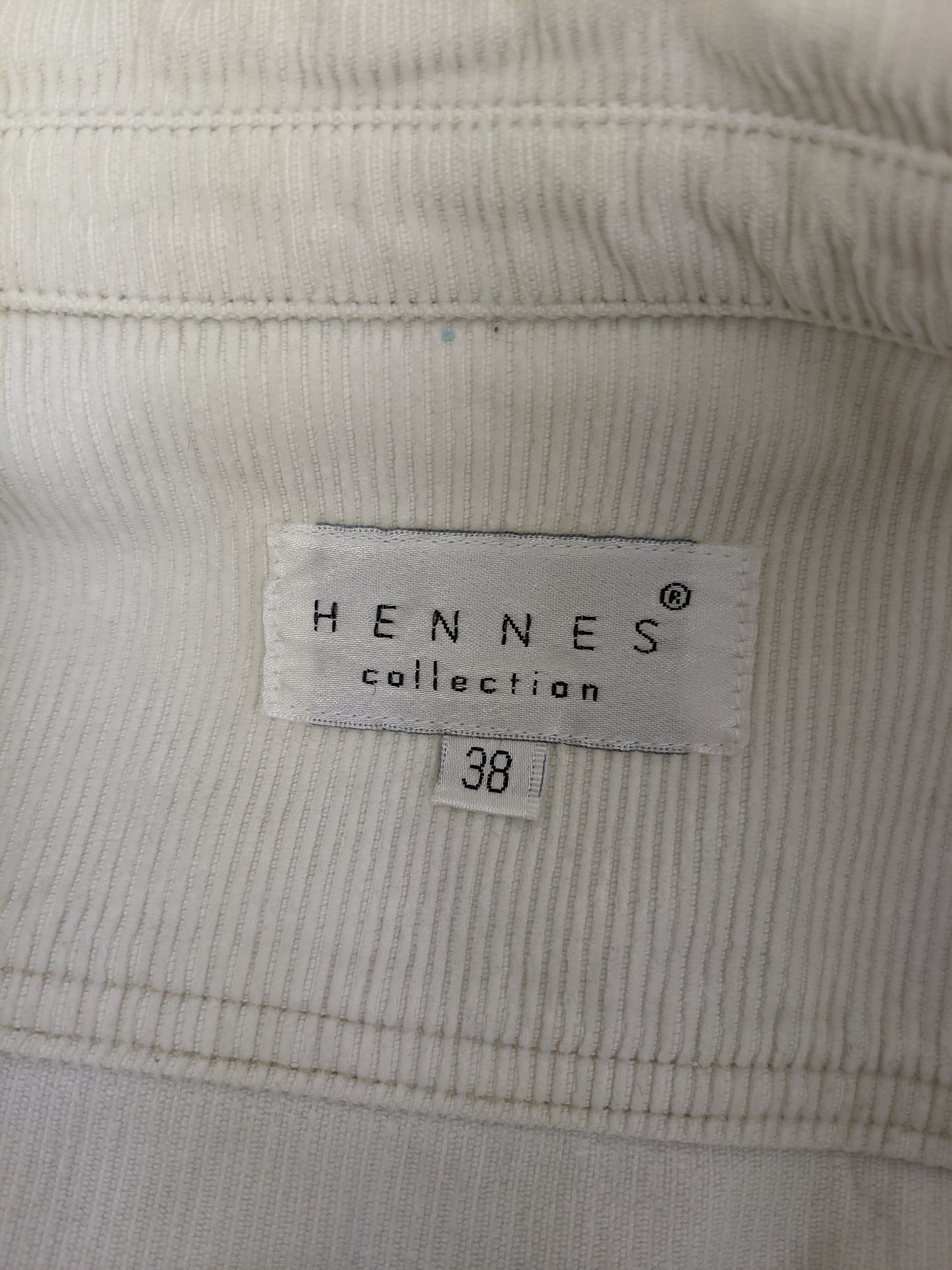 Close-up of Hennes Collection label showing size 38