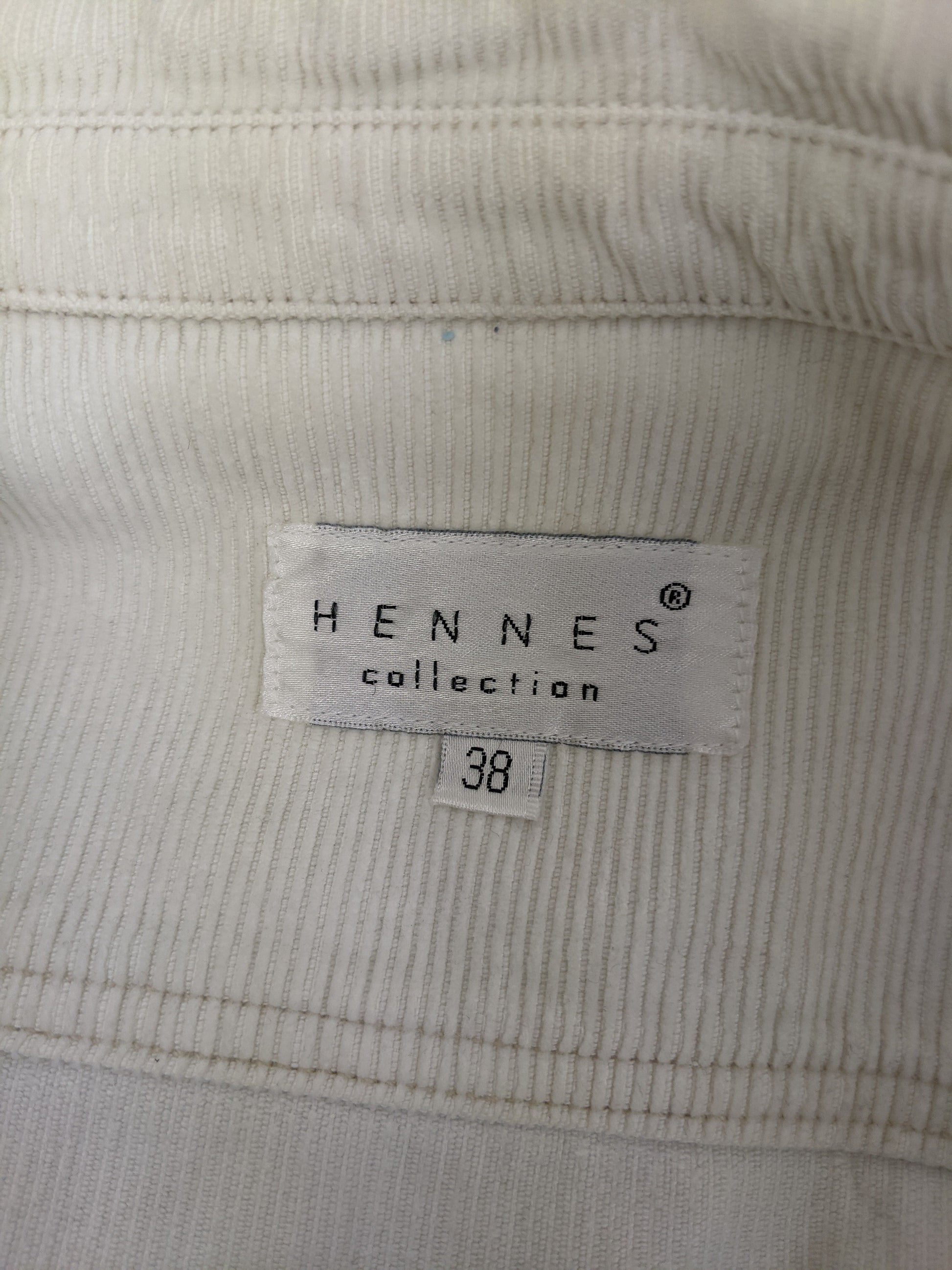 Close-up of Hennes Collection label showing size 38
