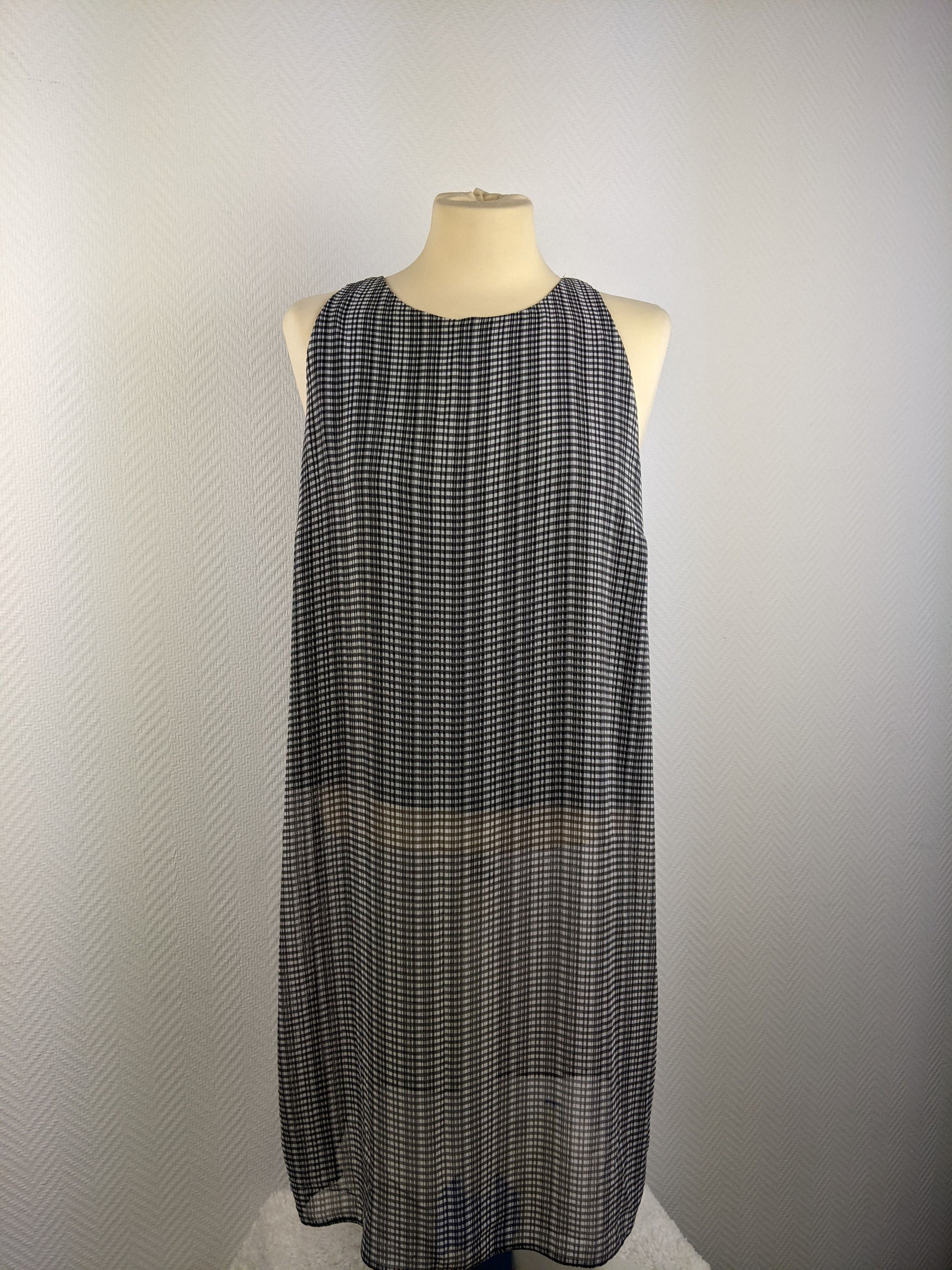 Front view of Atmosphere black and white checked dress