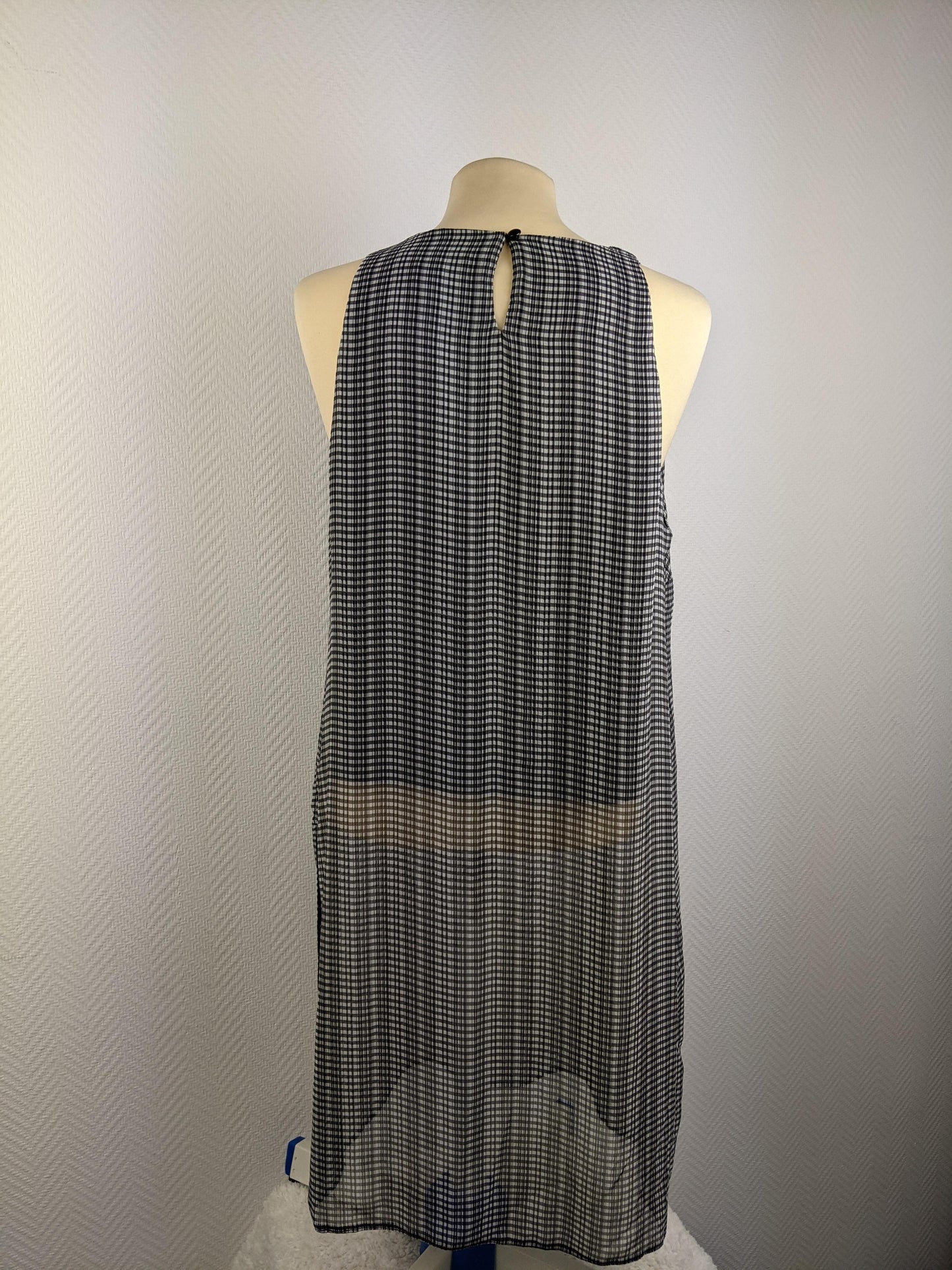 Back view of Atmosphere black and white checked dress showing button detail