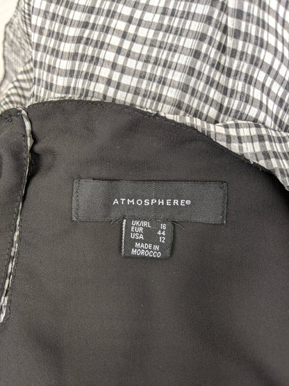 Close-up of Atmosphere brand label and size tag