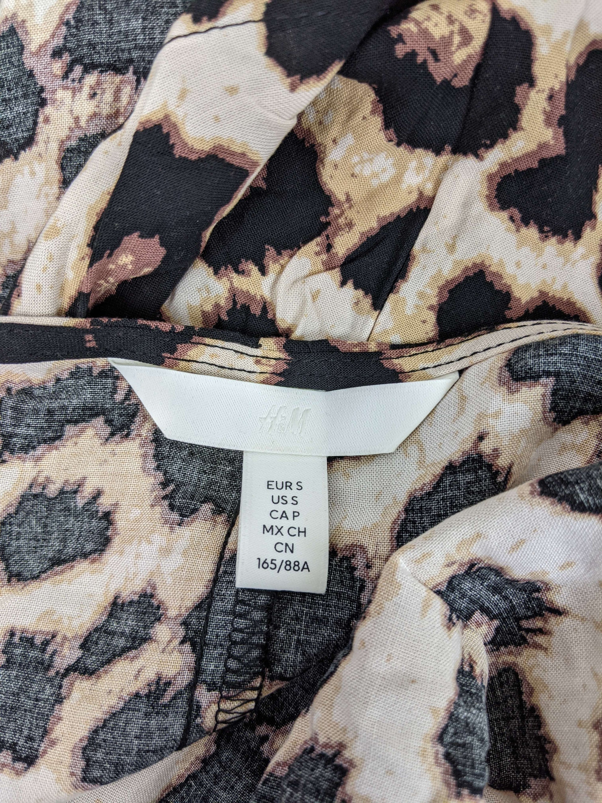Close-up of dress label showing size S