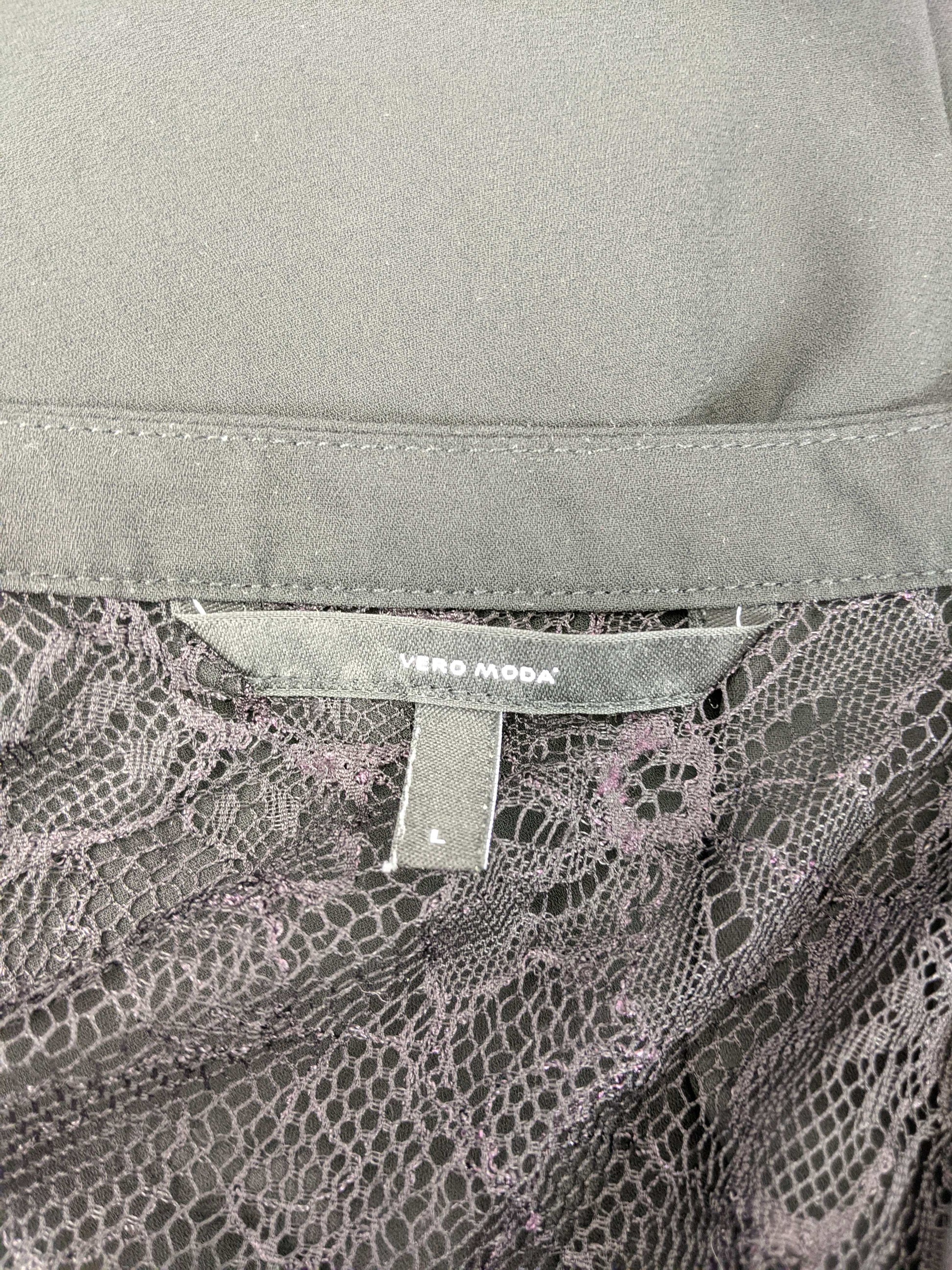 Close-up of Vero Moda label on black blouse