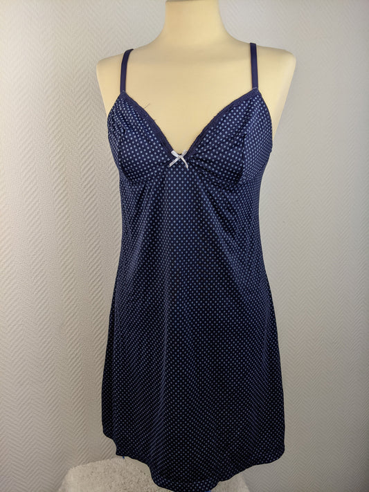 Front view of blue polka dot slip dress on mannequin
