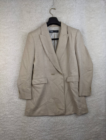 Front view of Zara beige blazer on hanger