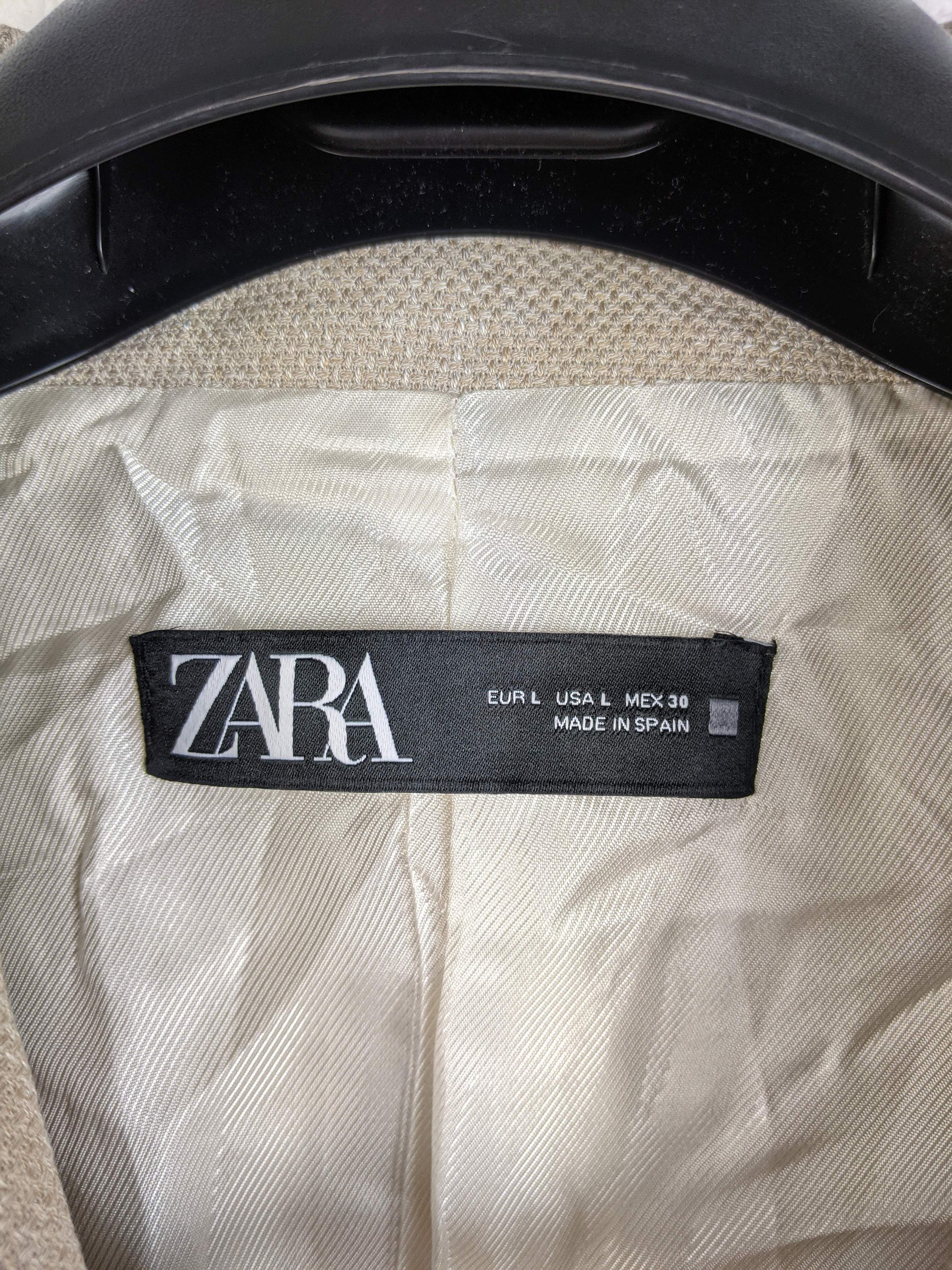 Close-up of Zara label inside blazer