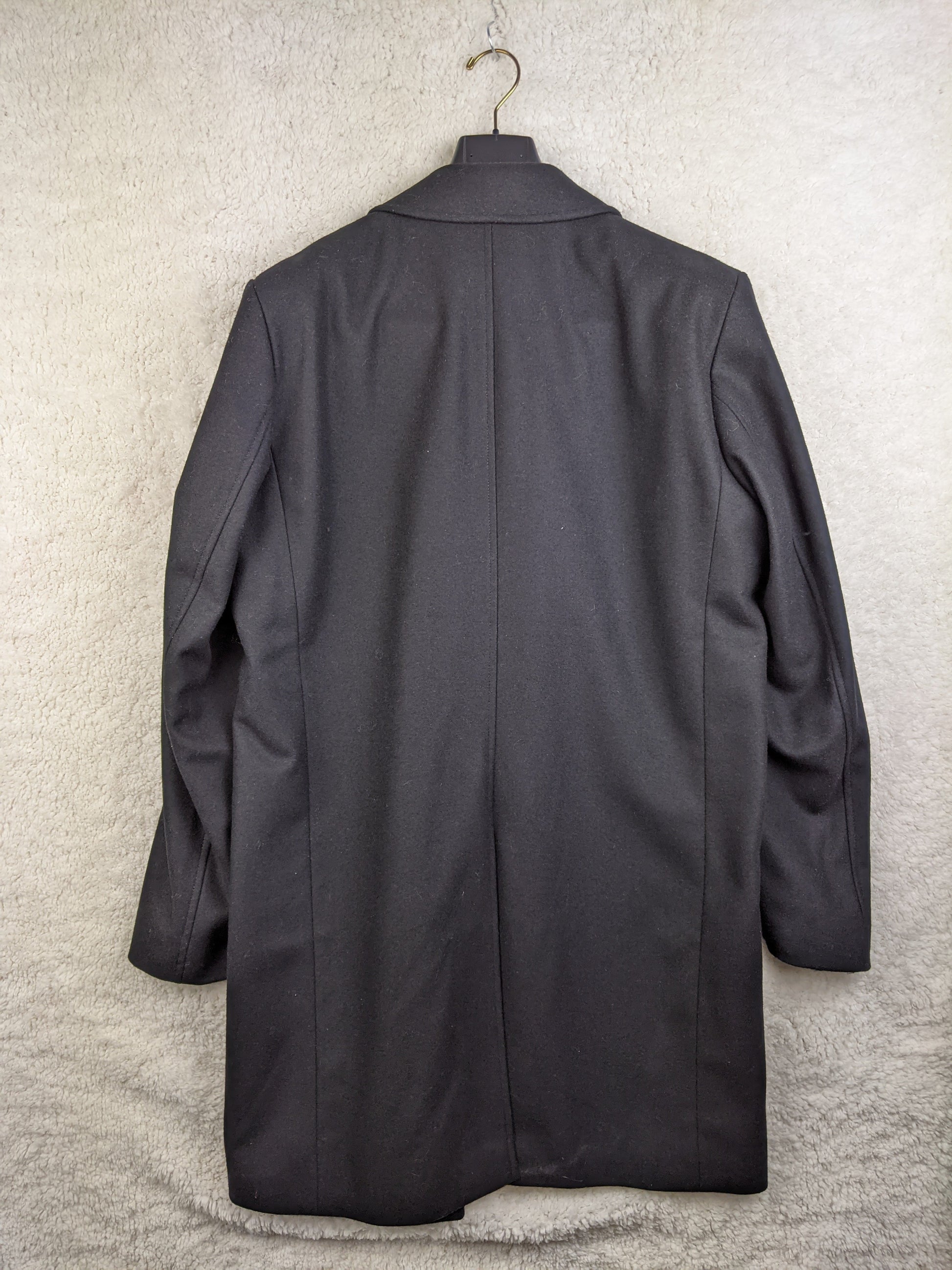 Back view of black de Bijenkorf wool blend coat
