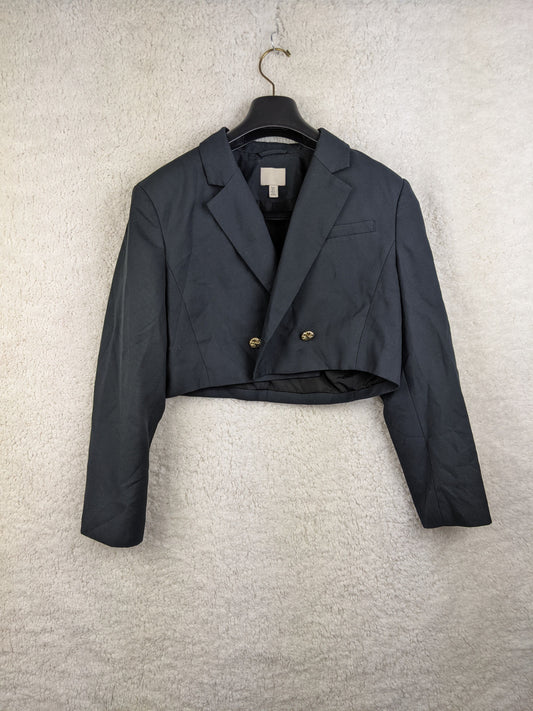 Front view of a black cropped blazer