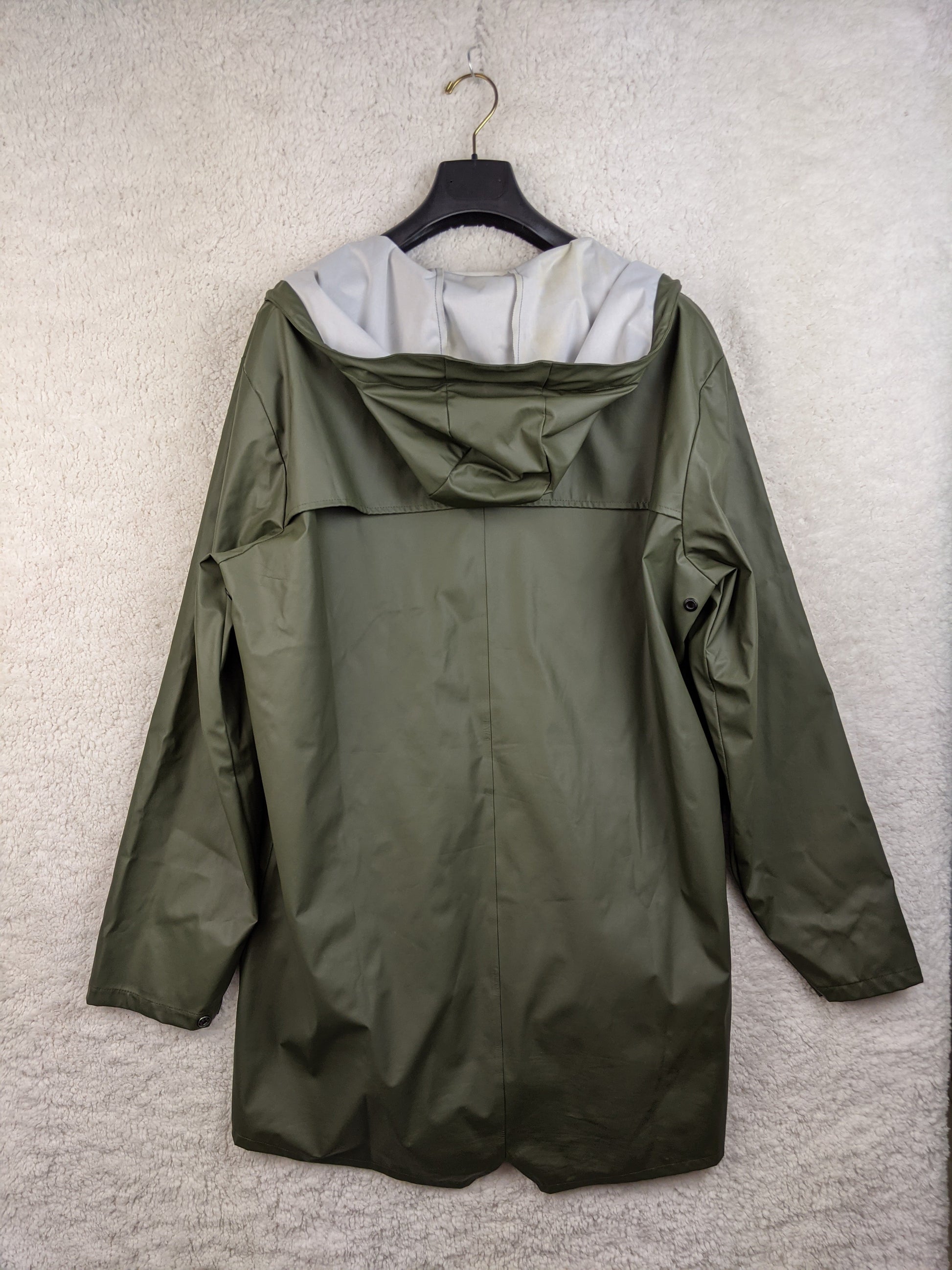 Back view of olive green raincoat