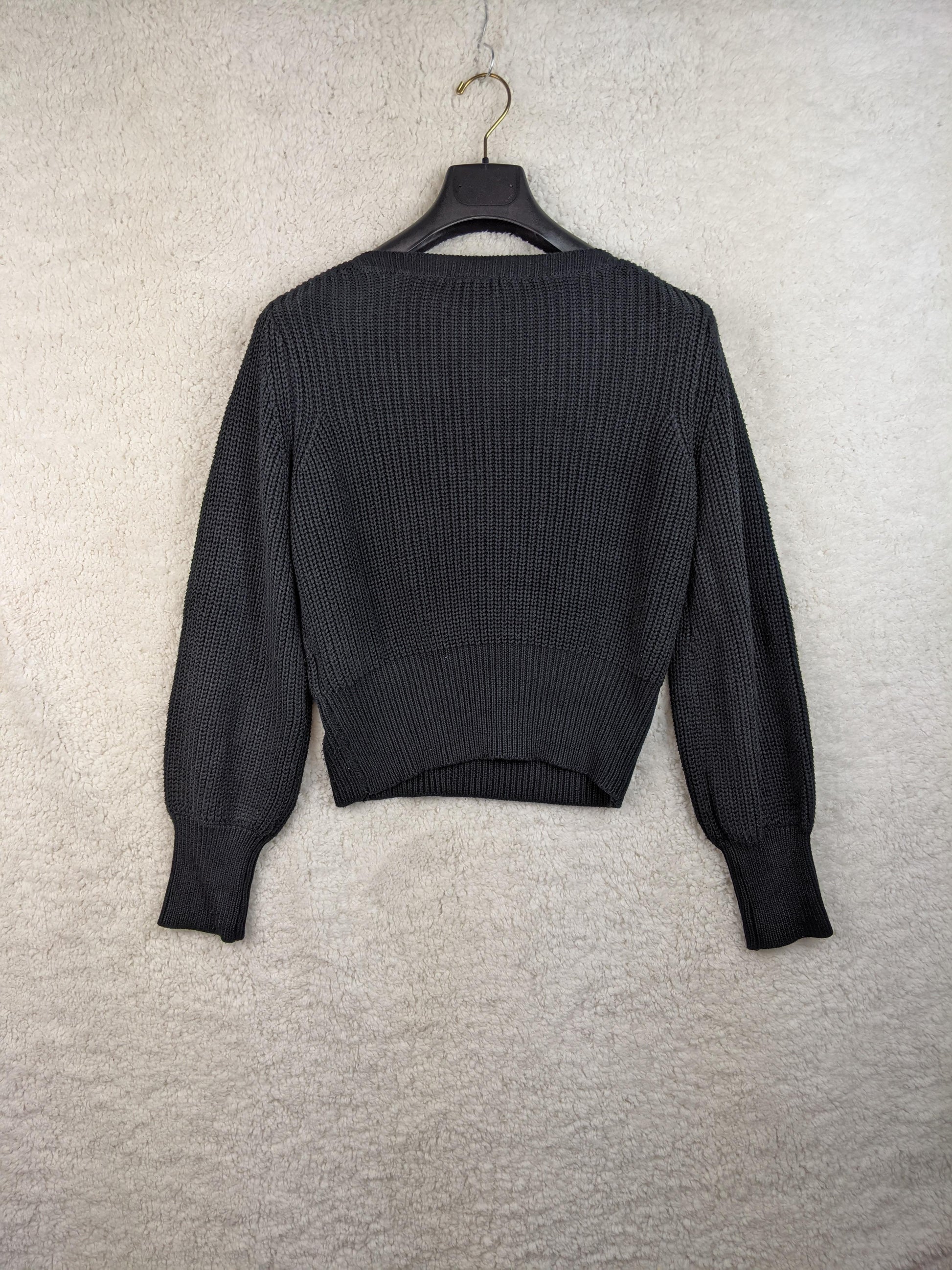 Back view of black H&M knit sweater