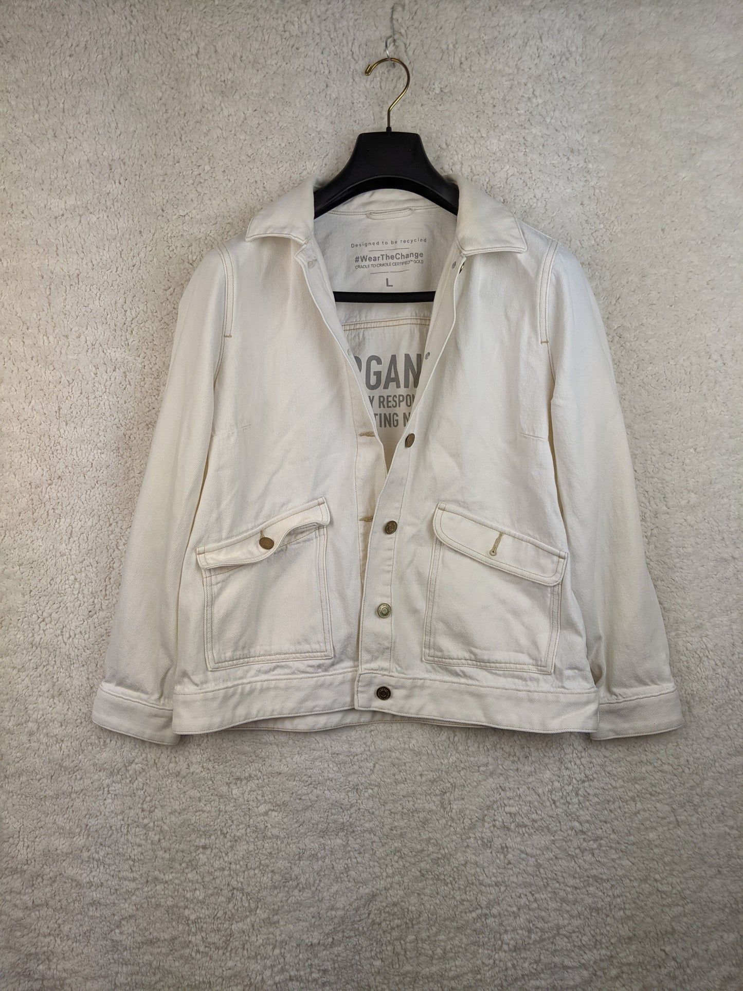 Front view of white sustainable denim jacket