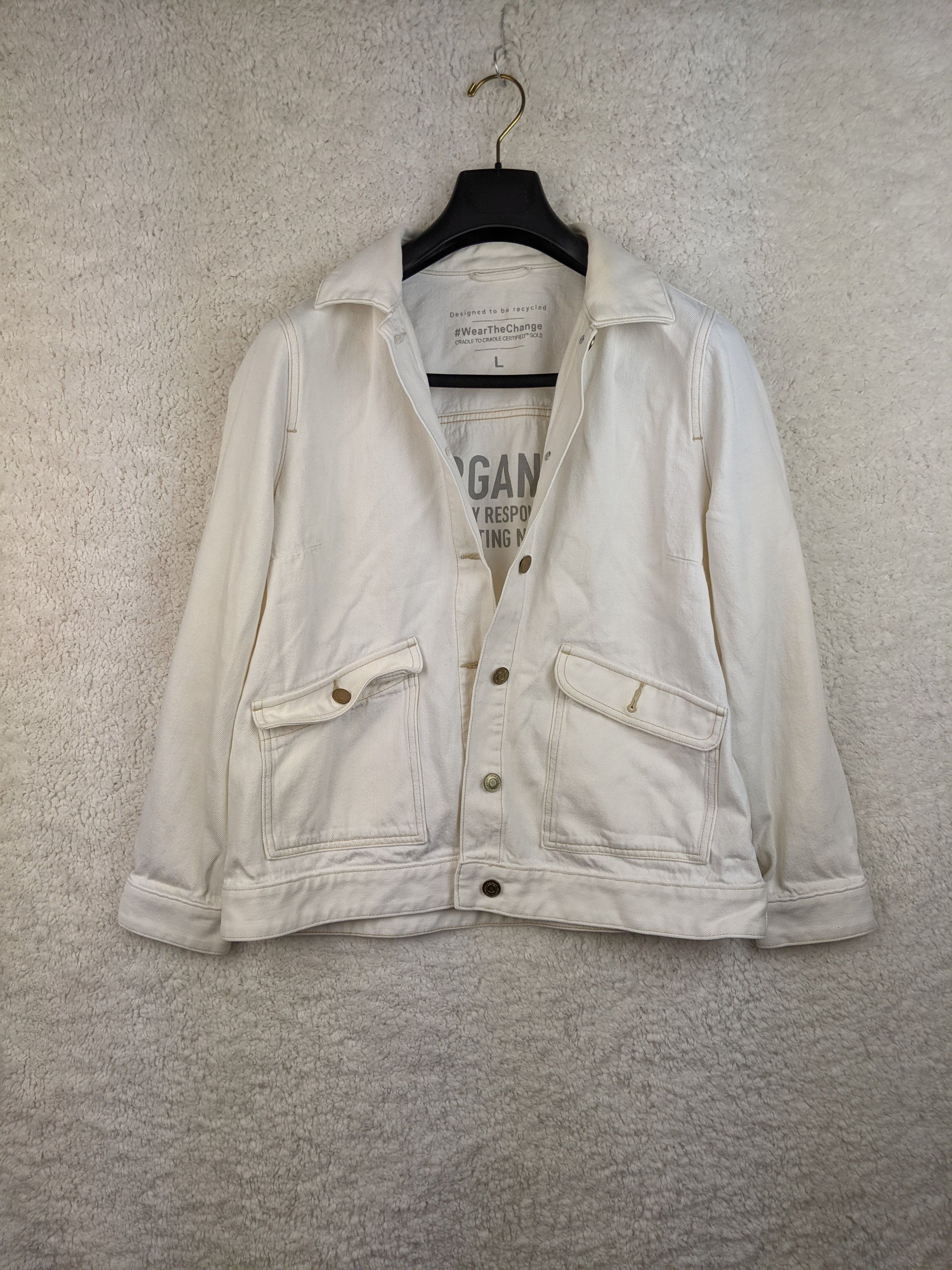 Front view of white sustainable denim jacket