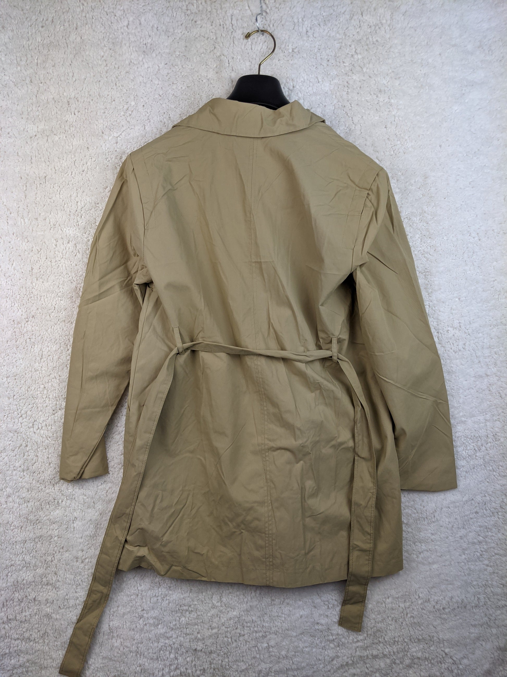 Beige lightweight jacket on hanger, back view