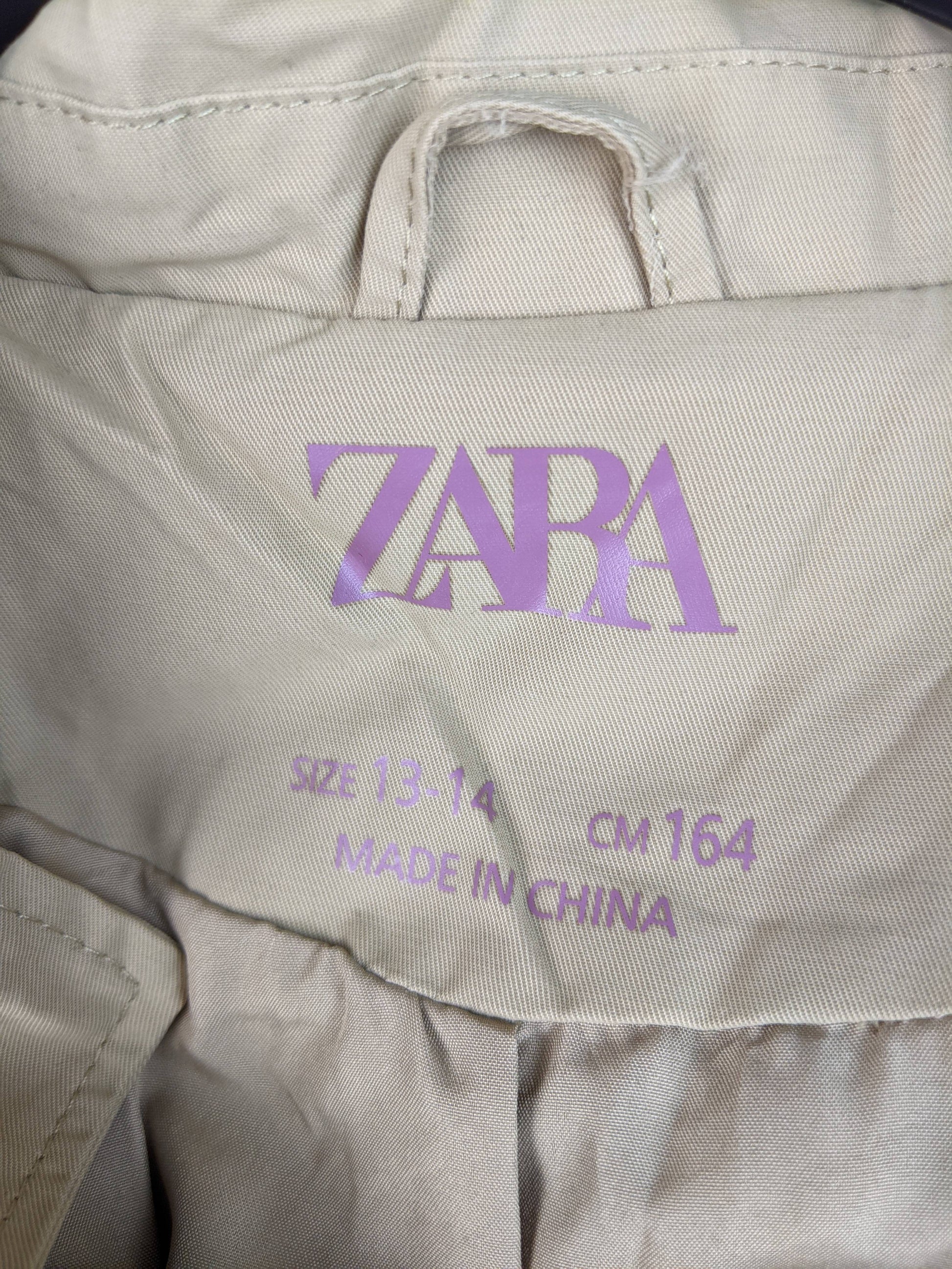 Close-up of Zara label on beige jacket