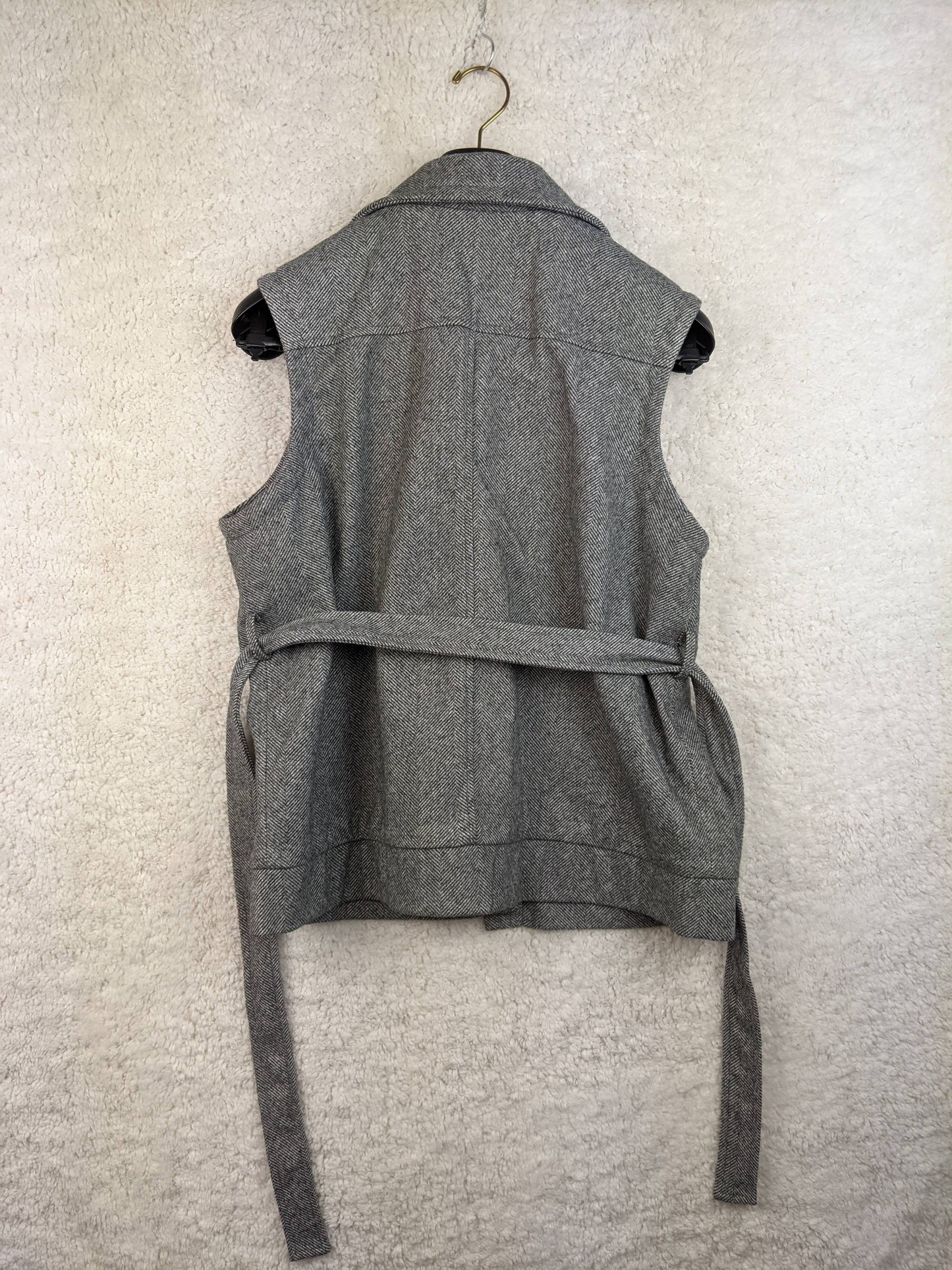 Back view of grey herringbone vest