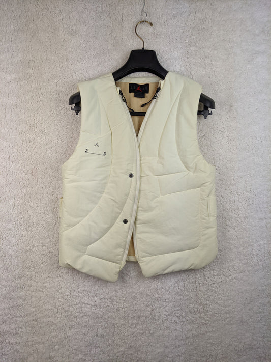 Front view of cream Jordan padded vest