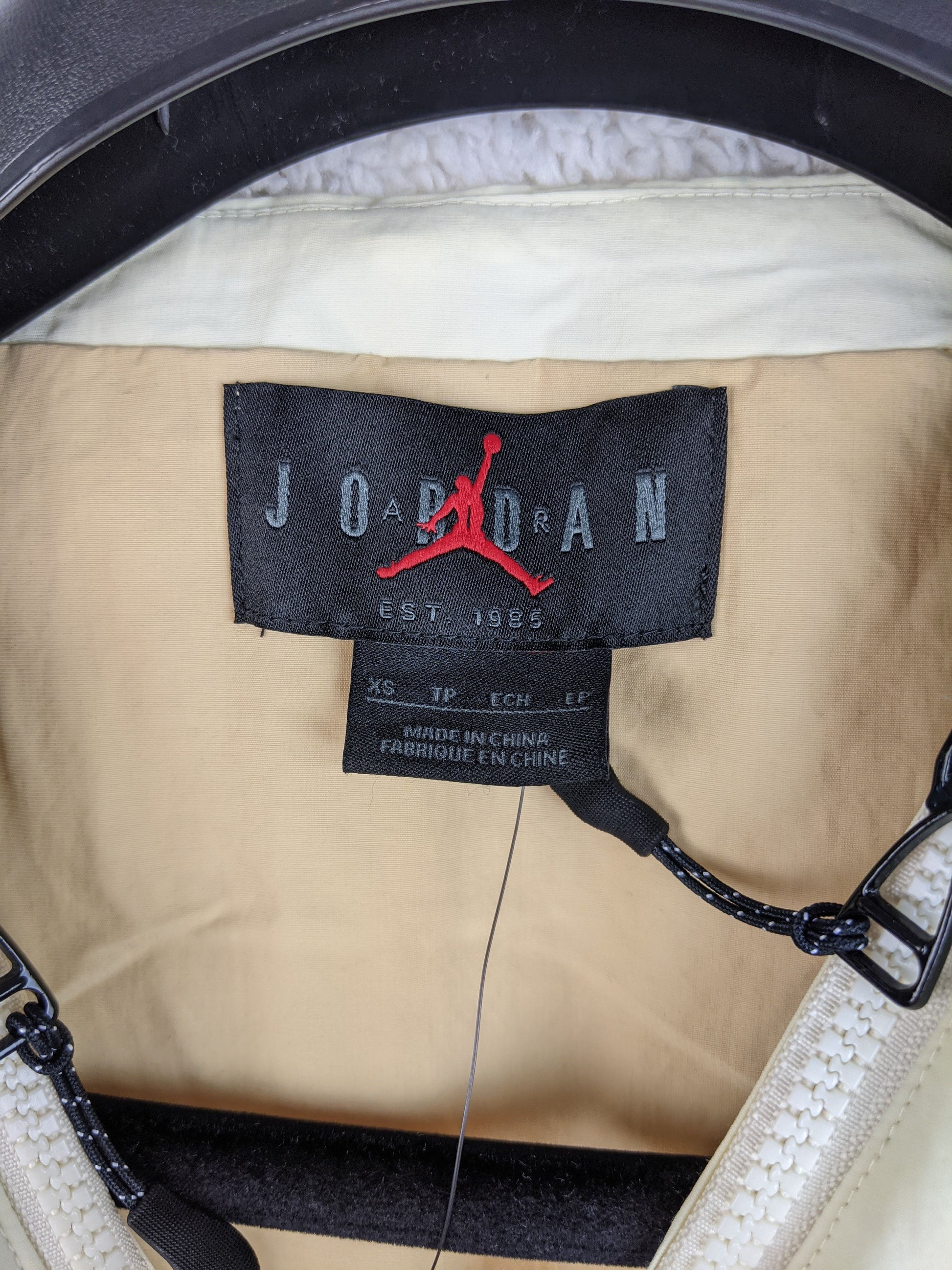 Label showing 'Jordan' branding and size XS