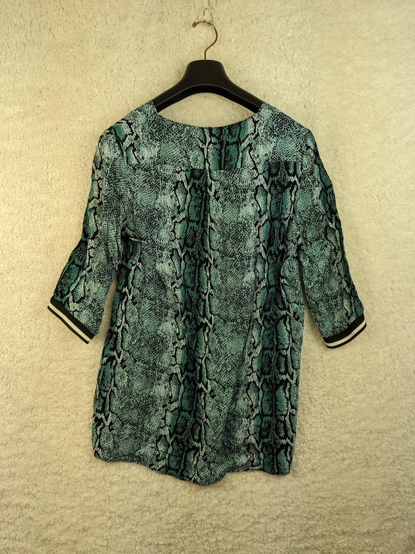 Back view of snake print blouse