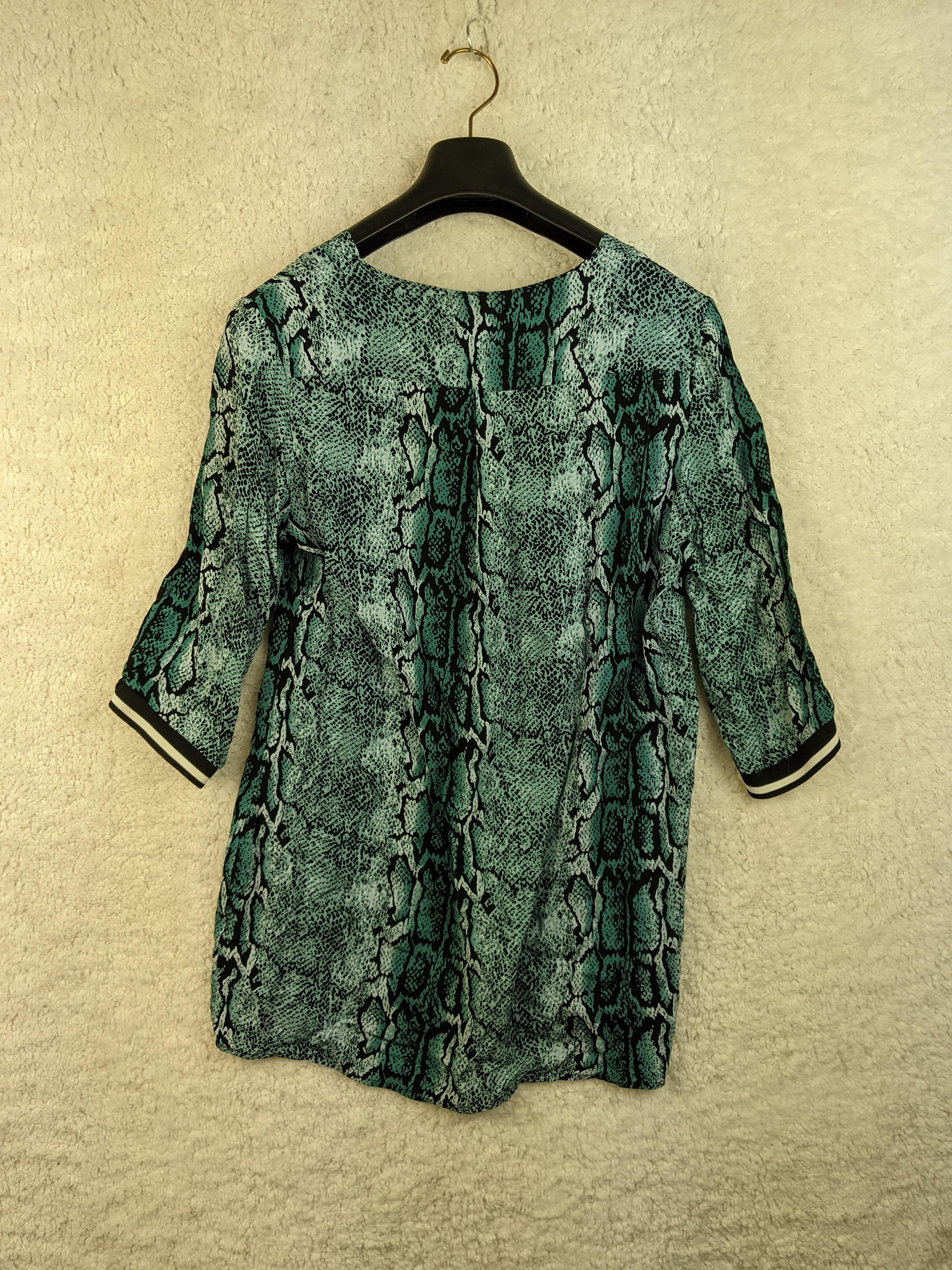 Back view of snake print blouse
