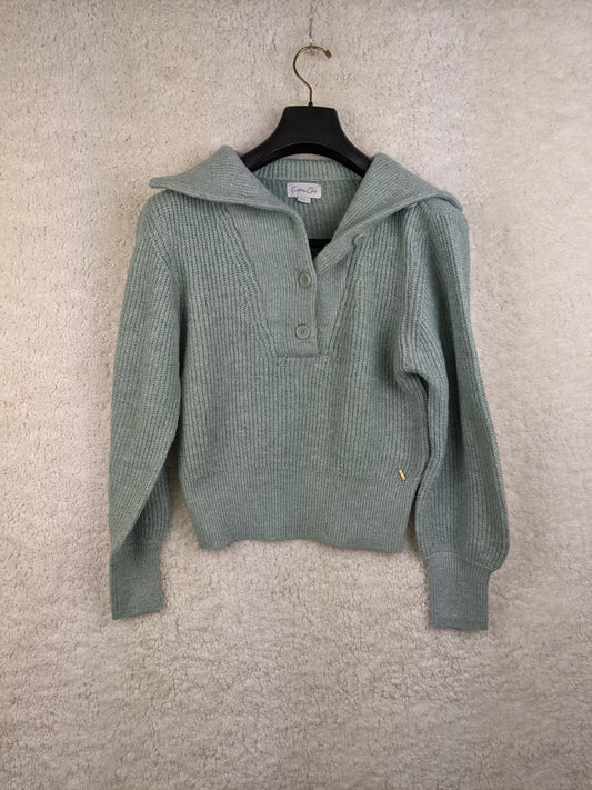 Front view of light green ribbed sweater