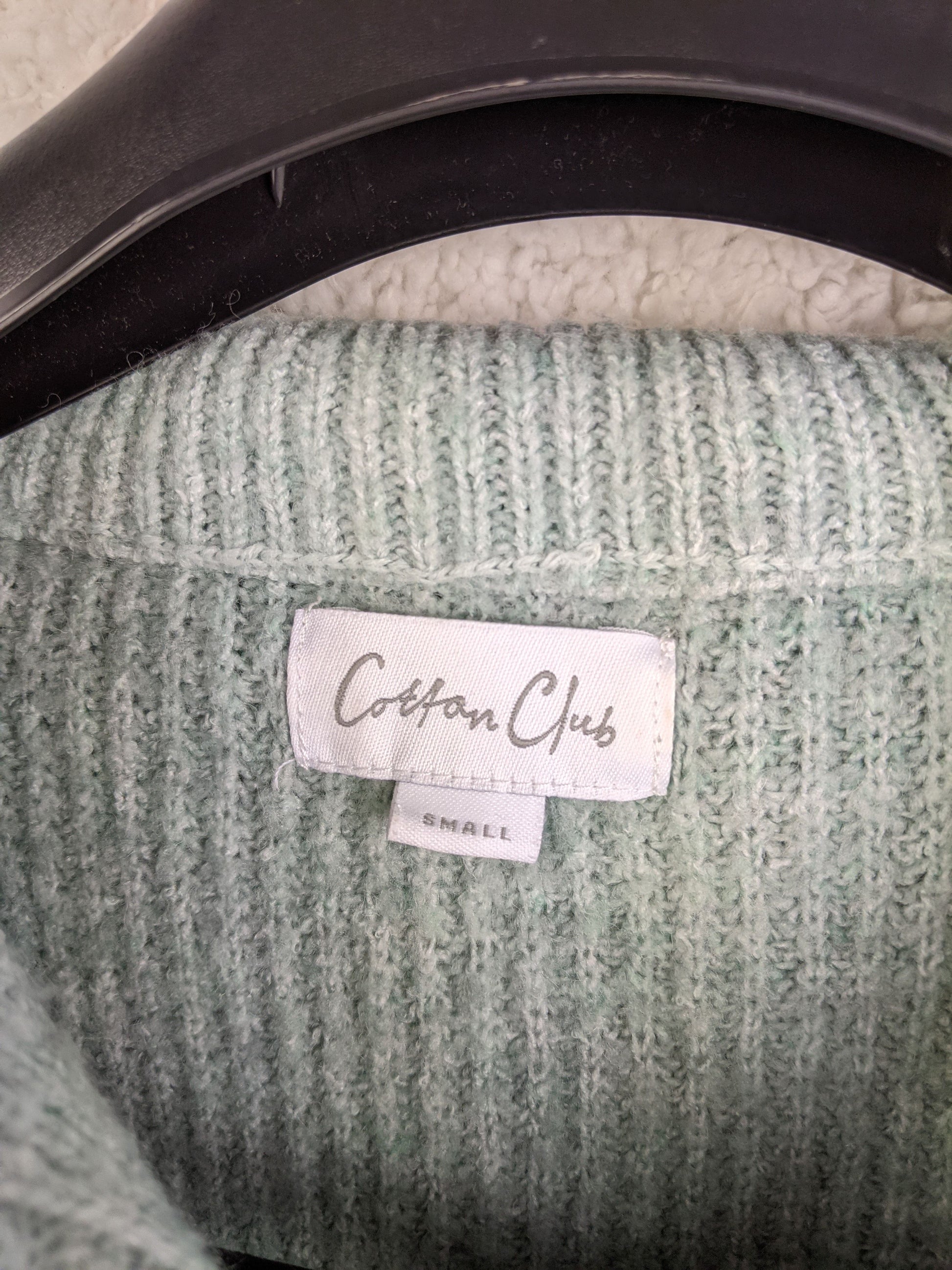 Close-up of Cotton Club label in the sweater
