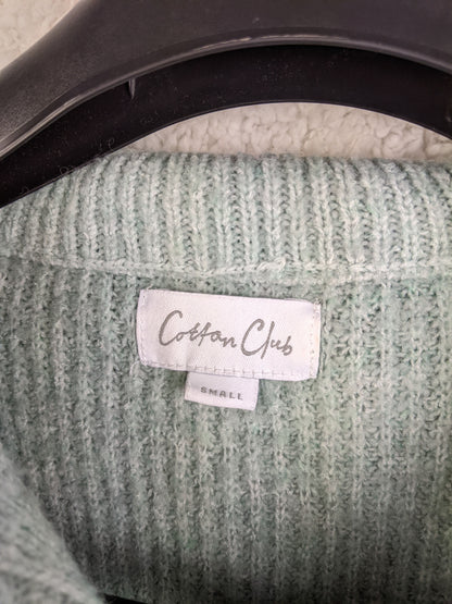 Close-up of Cotton Club label in the sweater
