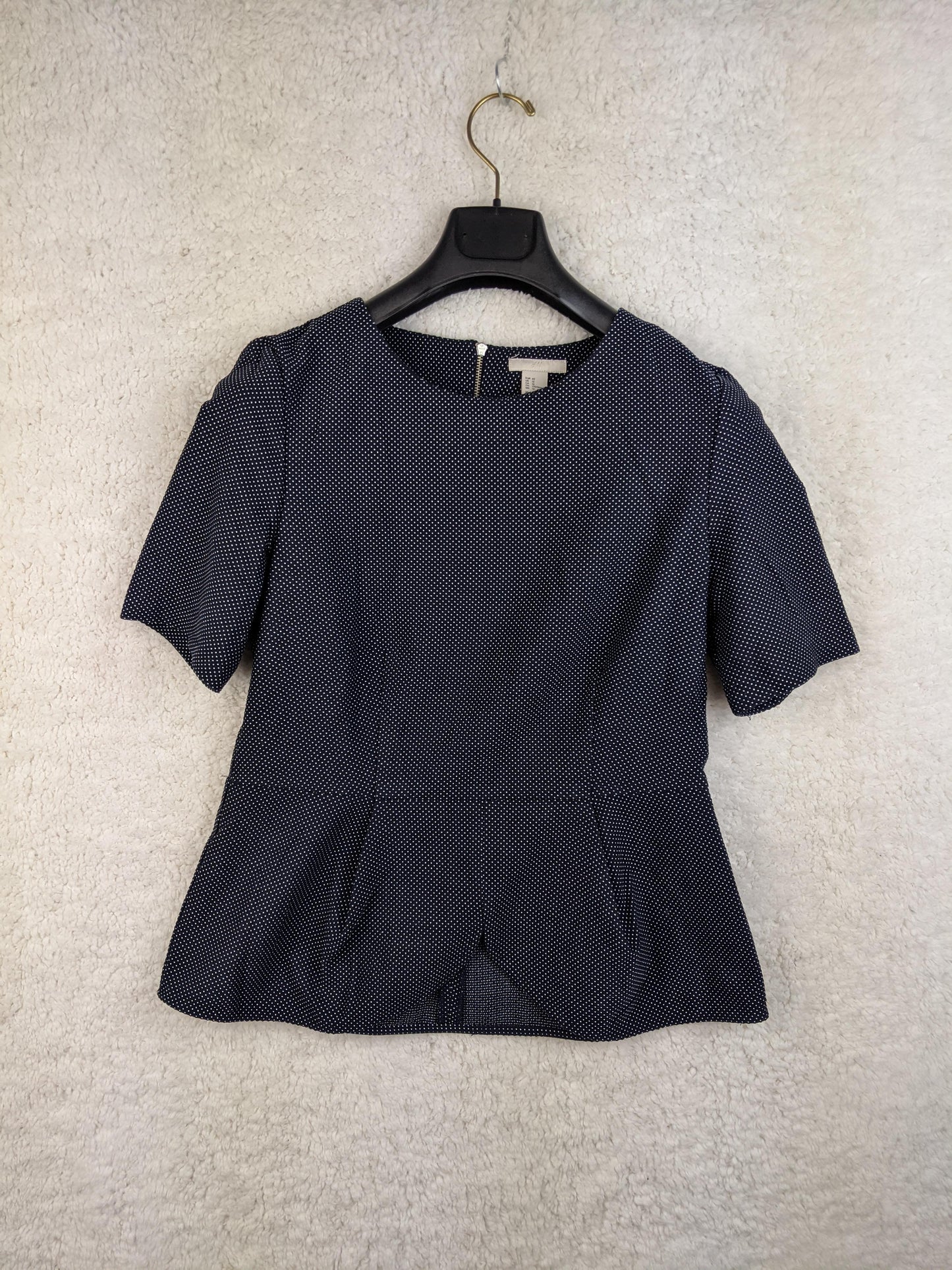 Navy polka dot blouse front view