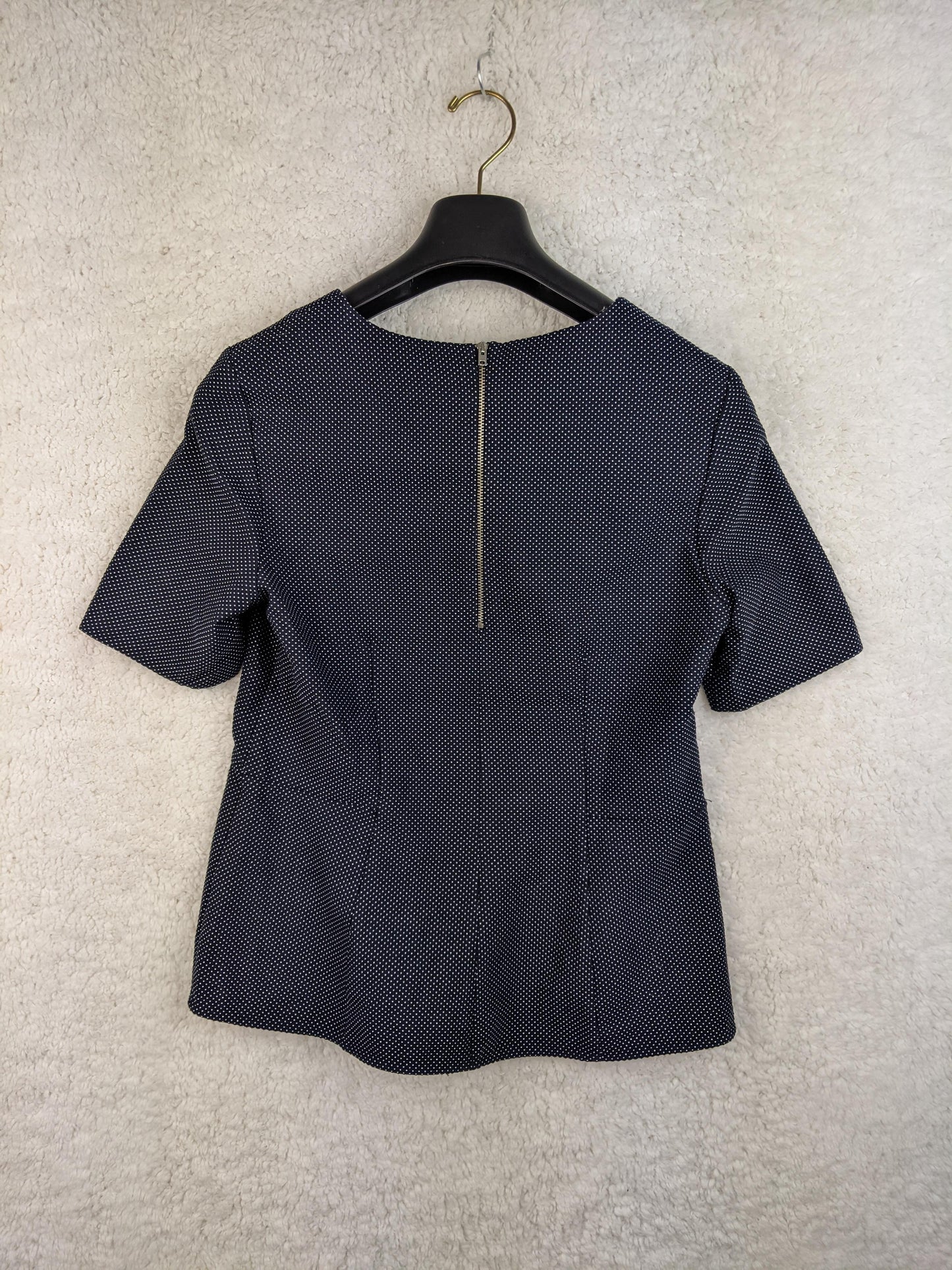 Navy polka dot blouse back view