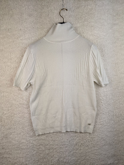 Front view of white ribbed turtleneck sweater