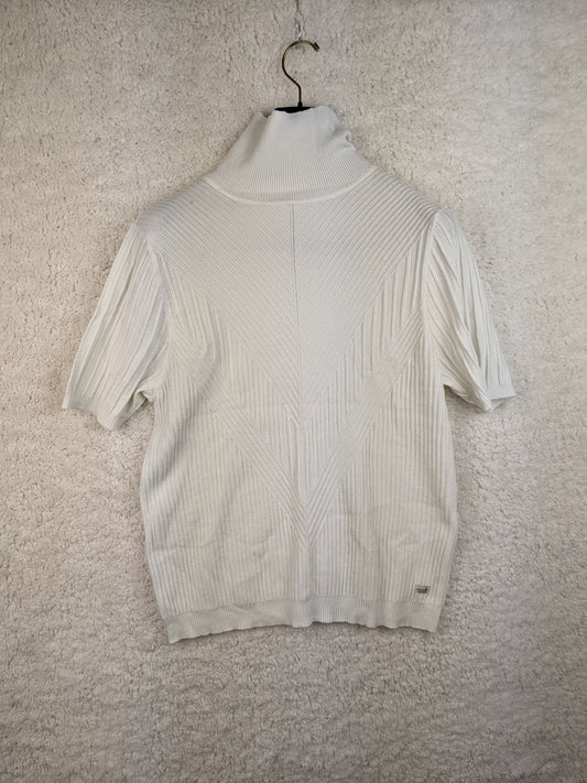 Front view of white ribbed turtleneck sweater