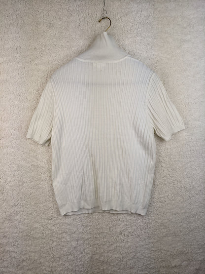 Back view of white ribbed turtleneck sweater