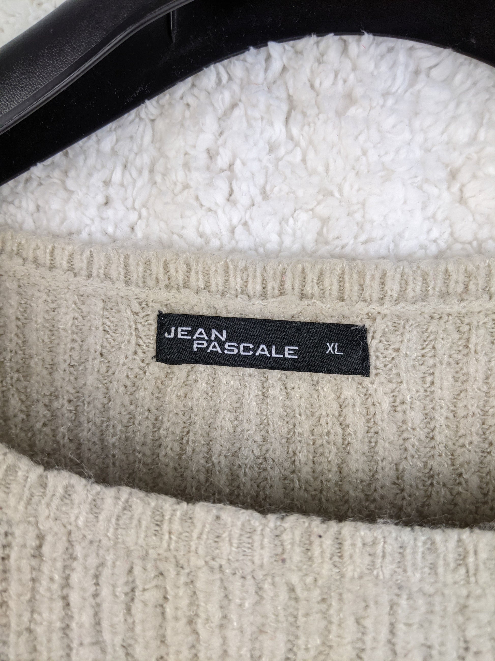 Close-up of Jean Pascale label on sweater