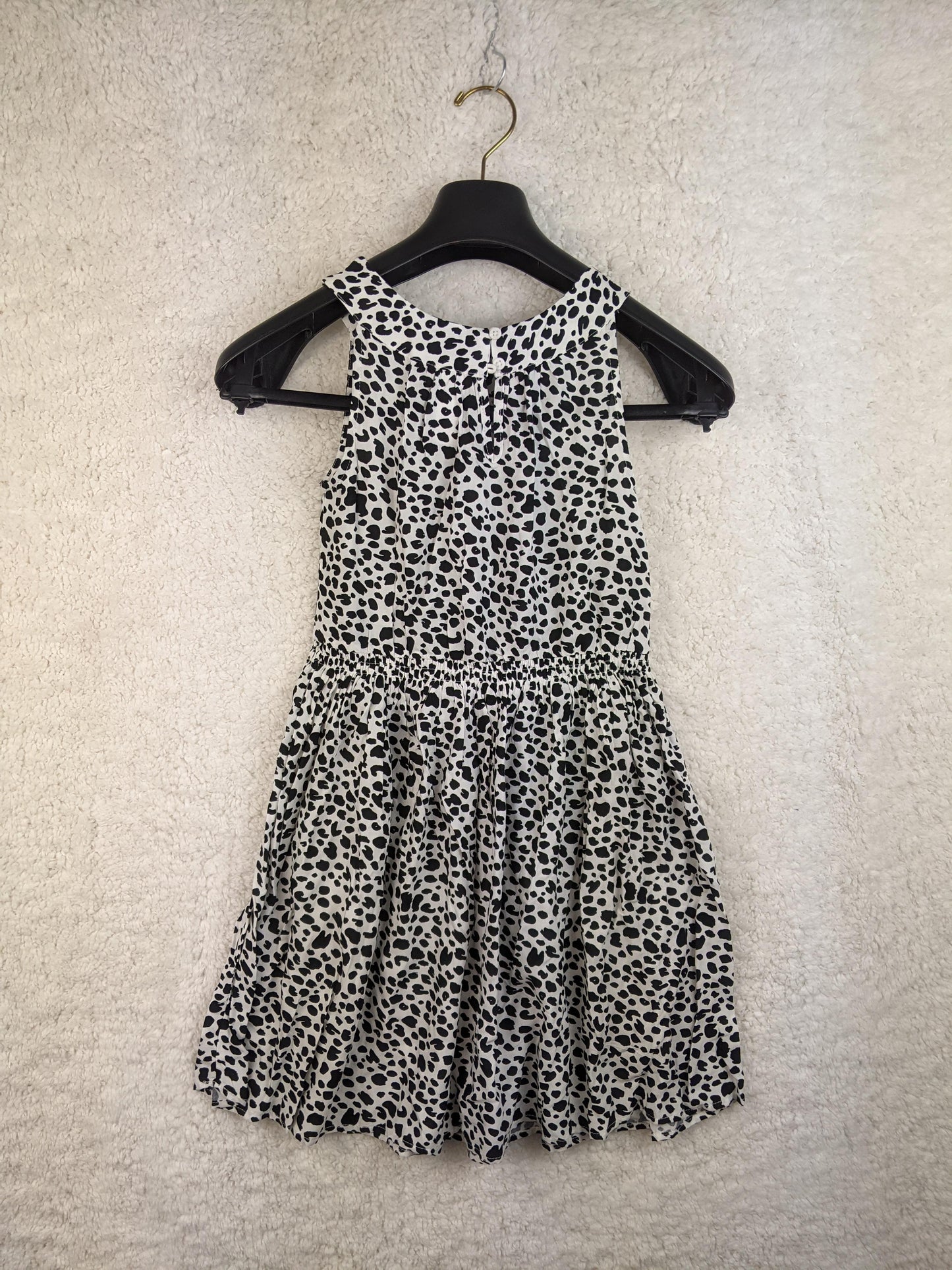Back view of black and white polka dot sundress