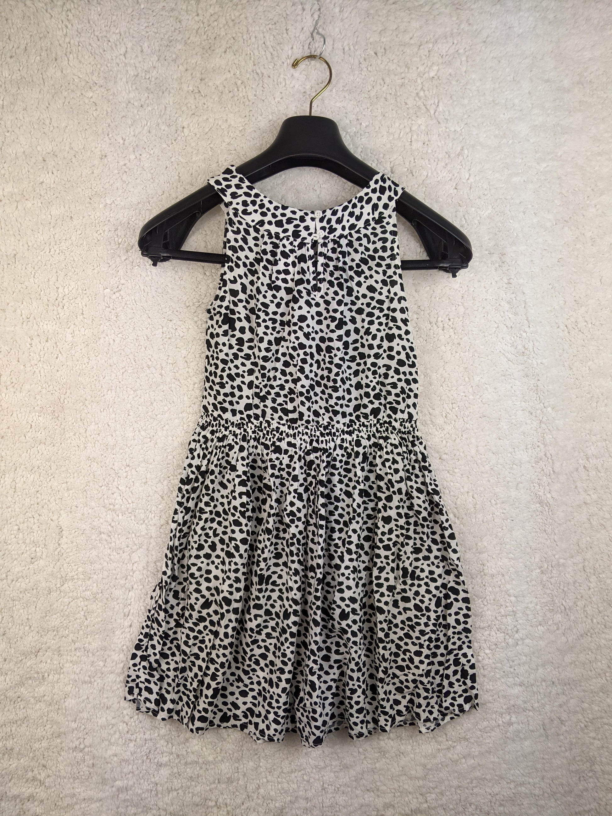 Back view of black and white polka dot sundress
