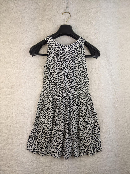 Back view of black and white polka dot sundress