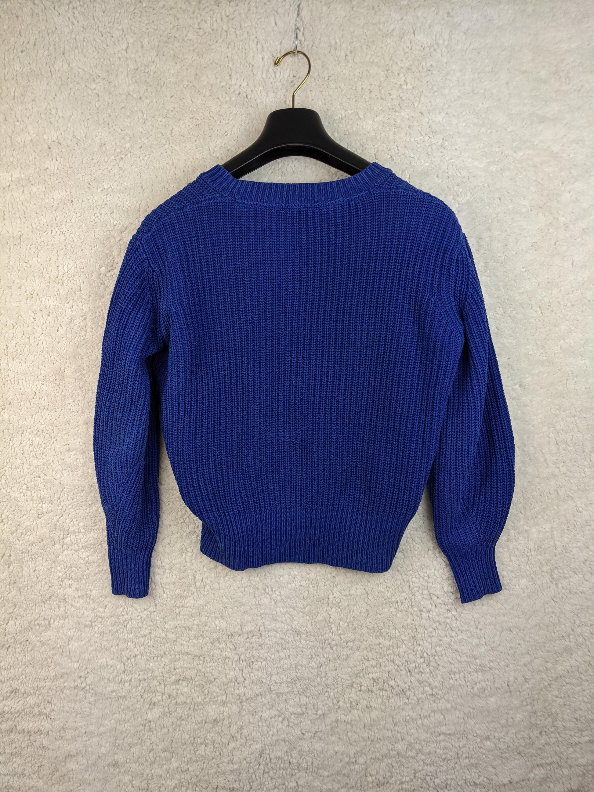 Back view of blue knit sweater