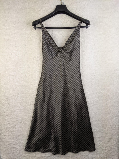 Savannah black and gray patterned dress hanging on a hanger