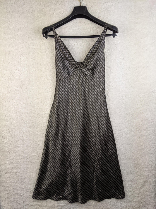 Savannah black and gray patterned dress hanging on a hanger
