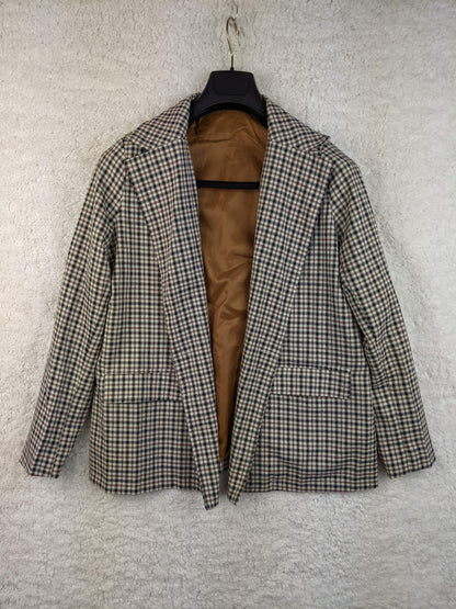 Front view of vintage plaid blazer on hanger