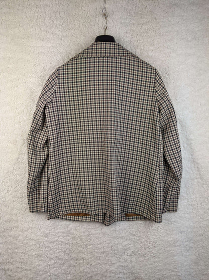 Back view of vintage plaid blazer on hanger
