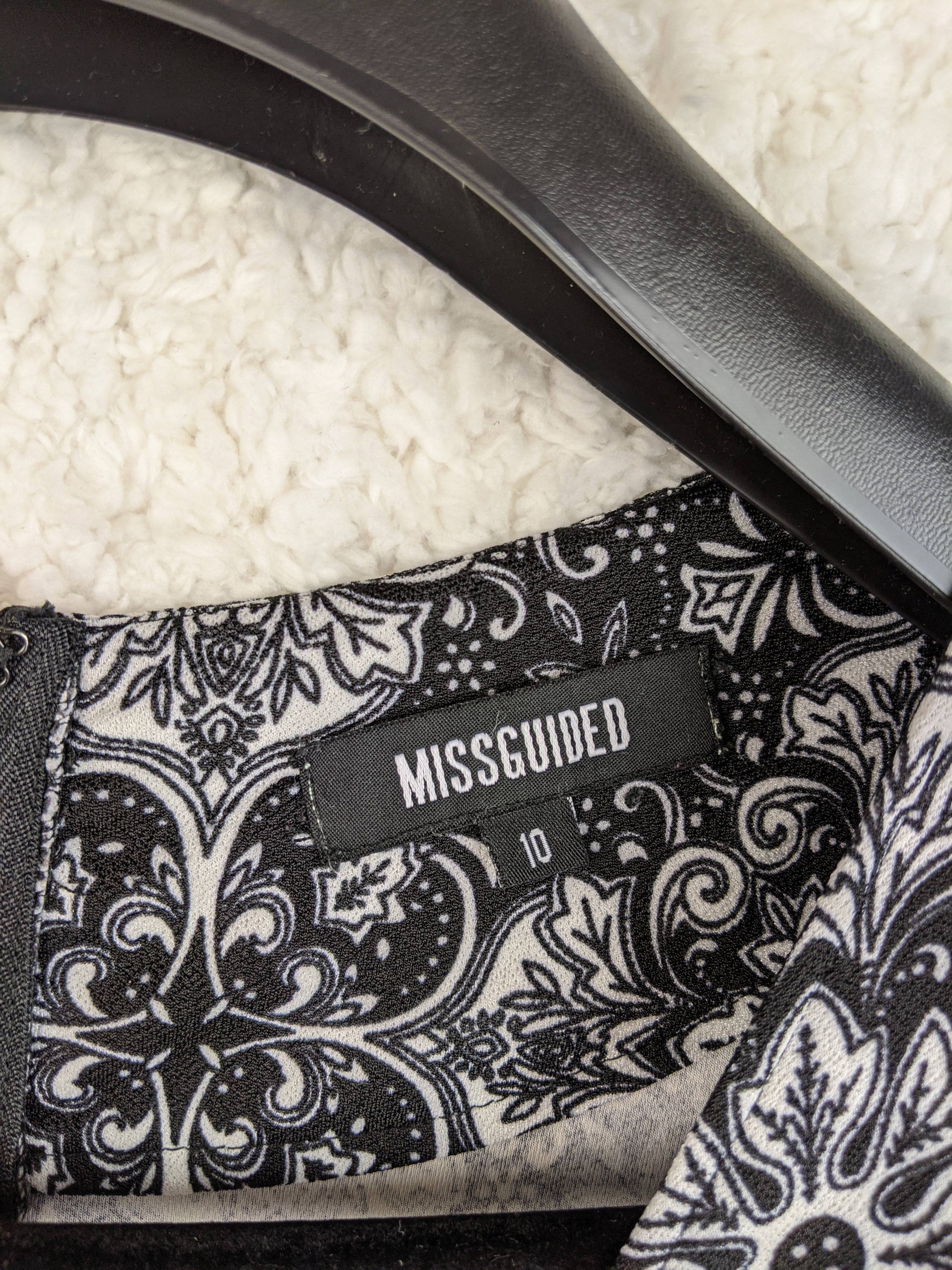 Close-up of Missguided label on romper