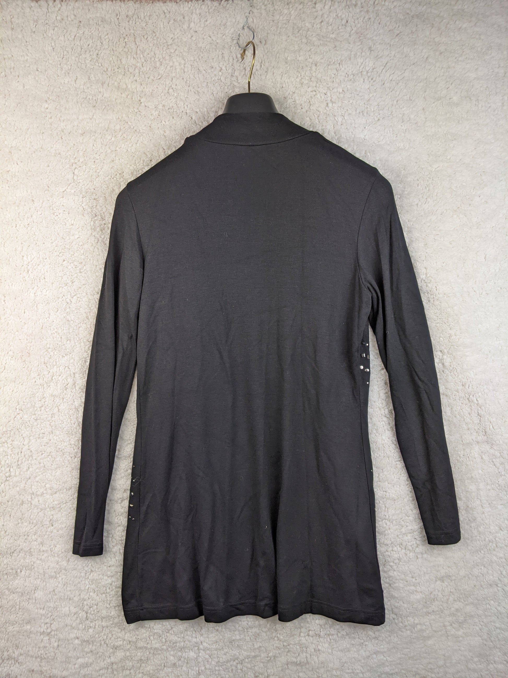 Back view of black open front cardigan