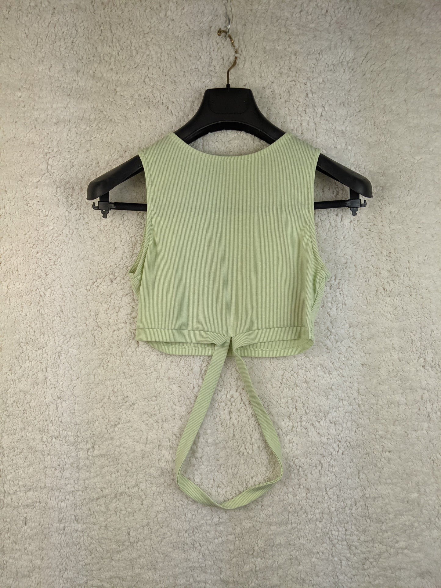 Mint green ribbed crop top on hanger, front view