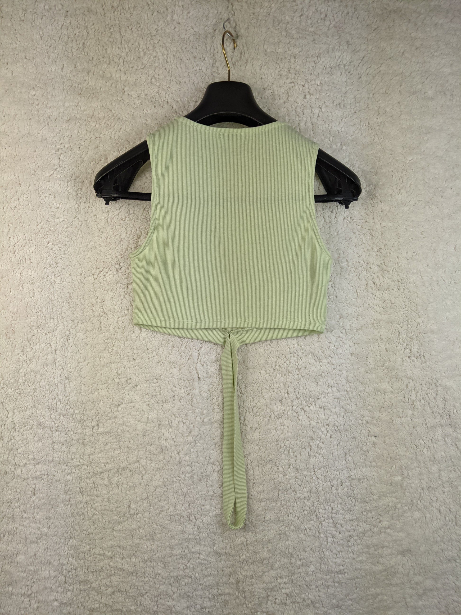 Mint green ribbed crop top on hanger, back view
